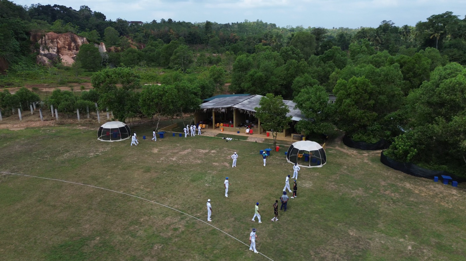 Players walking out by the pavilion - DHH Turf Cricket Grounds Negombo Sri Lanka