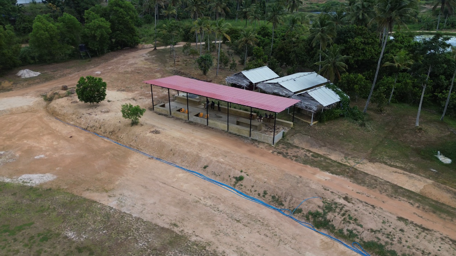 Red-roofed pavilion & tree-lined surroundings - DHH Turf Cricket Grounds Negombo Sri Lanka